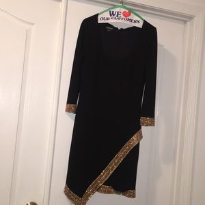 Medium black Bebe dress with gold accents